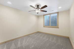 Unfurnished room featuring visible vents, carpet floors, baseboards, recessed lighting, and a ceiling fan