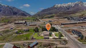 Birds eye view of property with a mountain view