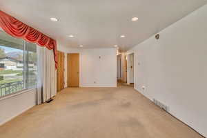 Living room featuring recessed lighting, and light carpet