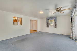 Family room featuring carpet floors and ceiling fan