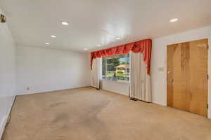 Living room featuring carpet floors and recessed lighting