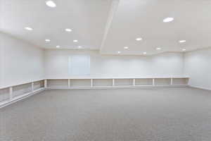 Empty room featuring carpet floors and recessed lighting