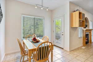 Spacious dining area with natural lighting.