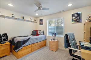 Bedroom featuring recessed lighting, ceiling fan, visible vents, baseboards, and light colored carpet