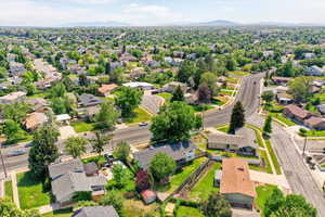 Aerial perspective of suburban area with a mountainous background