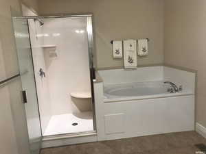 Primary bath with separate jetted tub and walk in shower
