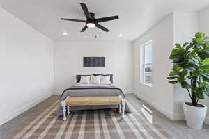 Carpeted bedroom featuring recessed lighting, baseboards, and ceiling fan