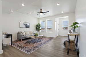 Living room featuring baseboards, recessed lighting, ceiling fan, and wood finished floors