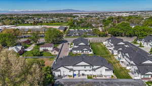 Birds eye view of property with a residential view and a mountain view