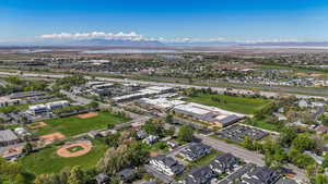Birds eye view of property with a residential view and a water and mountain view