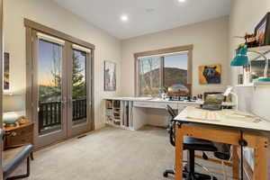 Home office featuring visible vents, french doors, recessed lighting, and light colored carpet