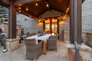View of patio featuring outdoor dining area and french doors