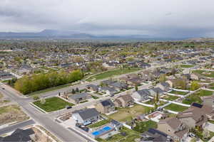 Birds eye view of property featuring a mountain view and a residential view