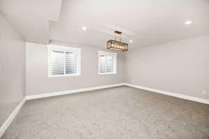 Unfurnished room featuring baseboards, carpet flooring, and recessed lighting