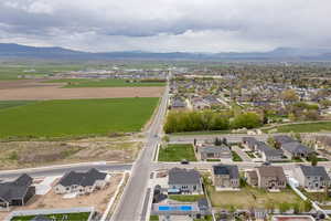 Birds eye view of property with a residential view and a mountain view