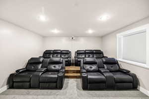 Cinema room with carpet floors, recessed lighting, and baseboards