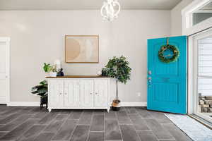 Foyer with baseboards and a wealth of natural light