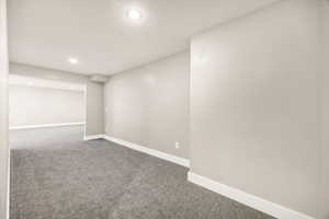 Finished basement featuring recessed lighting, baseboards, and carpet floors