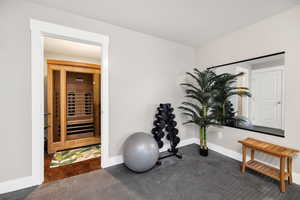 Exercise area with baseboards and beverage cooler