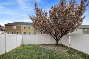 View of yard with a fenced backyard