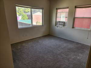 Carpetedbed room with cooling unit