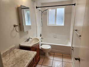 Full bath featuring tub / shower combination, toilet, tile patterned floors, and vanity
