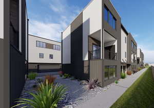 View of home's exterior featuring a garage, gravel driveway, and a balcony