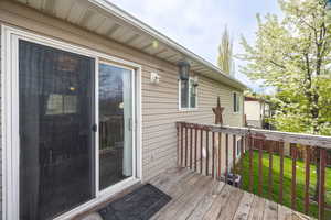 Wooden deck with a yard and cooling unit