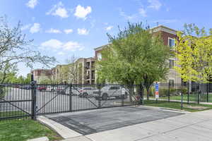 View of gate featuring fence