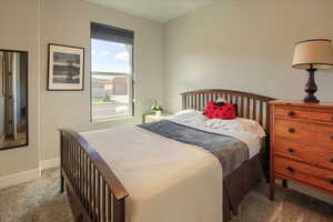 Carpeted bedroom with baseboards