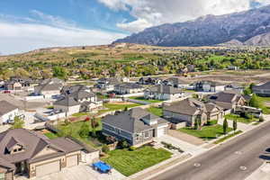 Birds eye view of property featuring a mountain view and a residential view