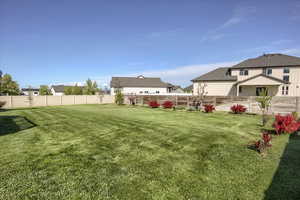 View of yard featuring fence