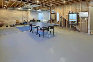 Rec room with finished concrete flooring