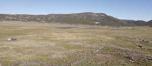 Property view of mountains with a rural view