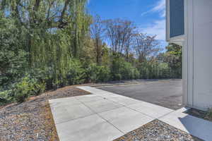 View of patio with a wooded view