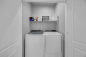 Laundry room featuring separate washer and dryer and laundry area