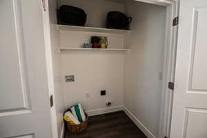 Clothes washing area with laundry area, baseboards, hookup for a washing machine, dark wood-style floors, and hookup for an electric dryer