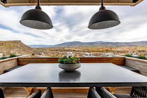 View of patio / terrace with a mountain view and a balcony