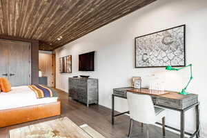 Bedroom featuring baseboards, recessed lighting, wood finished floors, and wooden ceiling