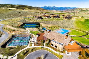 Birds eye view of property with a mountain view