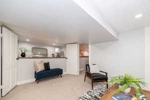 Basement living room showing seating area and shelf foundation.  Great as a TV room or sitting room.