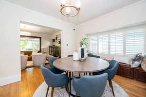 Dining space opens to the kitchen and front living room.  Large bench seat under window and bar seating with tons of natural light.
