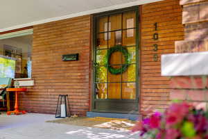 Front Entrance and covered porch with storm door
