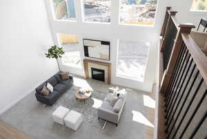 Living area with baseboards and a tile fireplace