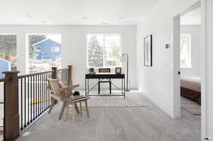 Office space featuring carpet floors, baseboards, and visible vents