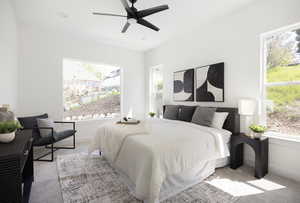Carpeted bedroom with baseboards and a ceiling fan