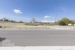 View of street featuring sidewalks and a mountain view