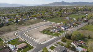 Birds eye view of property with a residential view and a mountain view