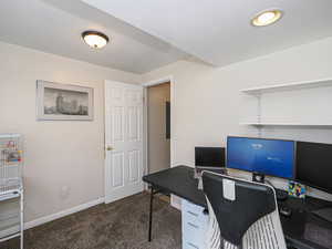 Office space featuring baseboards and carpet flooring
