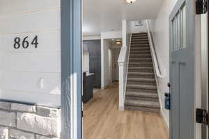 Stairs featuring baseboards and wood finished floors